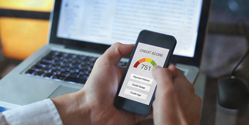 Buyer checking credit score before applying for new car financing